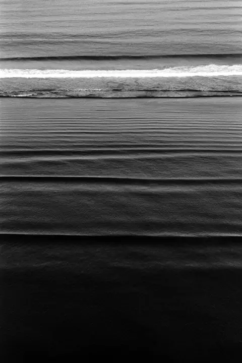 Long swell lines rolling in from open water